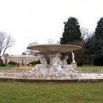 Fountain with orangery behind